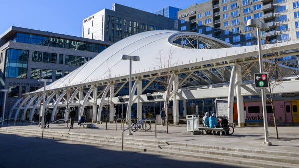 Curved white exterior of the train platform enclosure at Denver's Union Station resembles a giant insect.