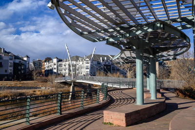 Curvy metal structures and bridges decorate Commons Park in downtown Denver, Colorado.