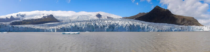 Panoramic view of the FjallsÃ¡rlÃ³n glacier in Iceland from a zodiac boat in the lagoon.