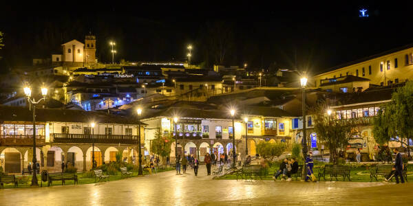 Christo Blanco glows from a dark hilltop in Cusco, seemingly floating on air.