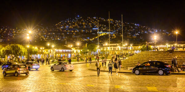 Lights twinkle on the hills around Cusco from Plaza da Armas.