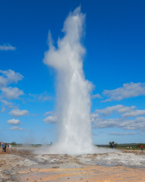 Eruption of the geyser Strokkur near Geysir, Iceland resembles a figure making rude gestures.