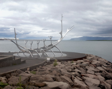 Iconic sculpture by  JÃ³n Gunnar Ãrnason shines on the seaside in Reykjavik.
