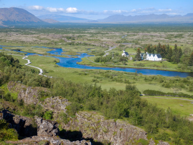 One of the oldest church sites in Iceland can be seen across the Ã–xarÃ¡ river in the great rift valley of Ãžingvellir national park.