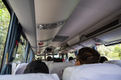 Riding a sleek modern bus on the twisting road up to Machu Picchu.