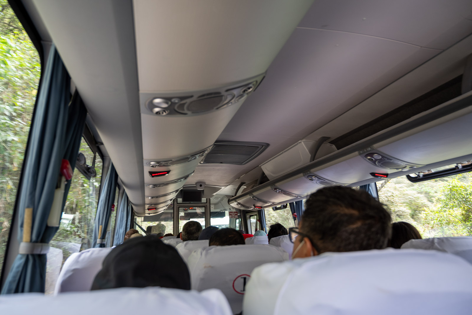 Riding a sleek modern bus on the twisting road up to Machu Picchu.