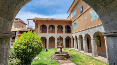 View of courtyard through an arch at Casa Andina San Blas