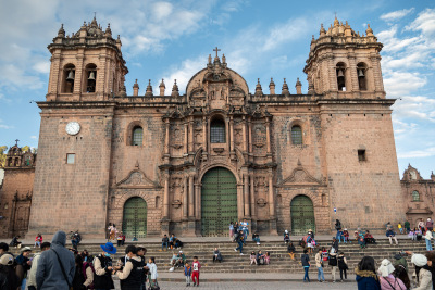People mingle on the steps of the main cathedral in Cusco