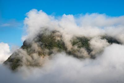 Fog surrounds a mountain peak near Machu Picchu