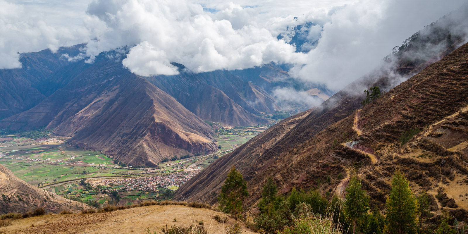 View into a lush valley from an overlook on the highway to Ollantaytambo.