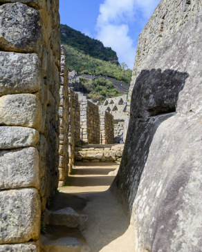 Shadows fill a corridor at Machu Picchu late in the afternoon.