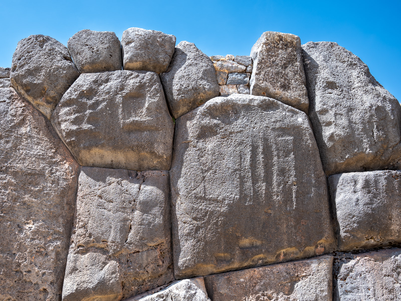 Stones arranged in a puma shape in a wall at SacsayhuamÃ¡n