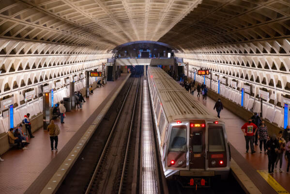 A train arriving at a DC Metro station completes a patriotic lighting scheme.