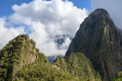 Tiny people can be spotted on the slopes of Huayna Picchu and its neighboring peak.