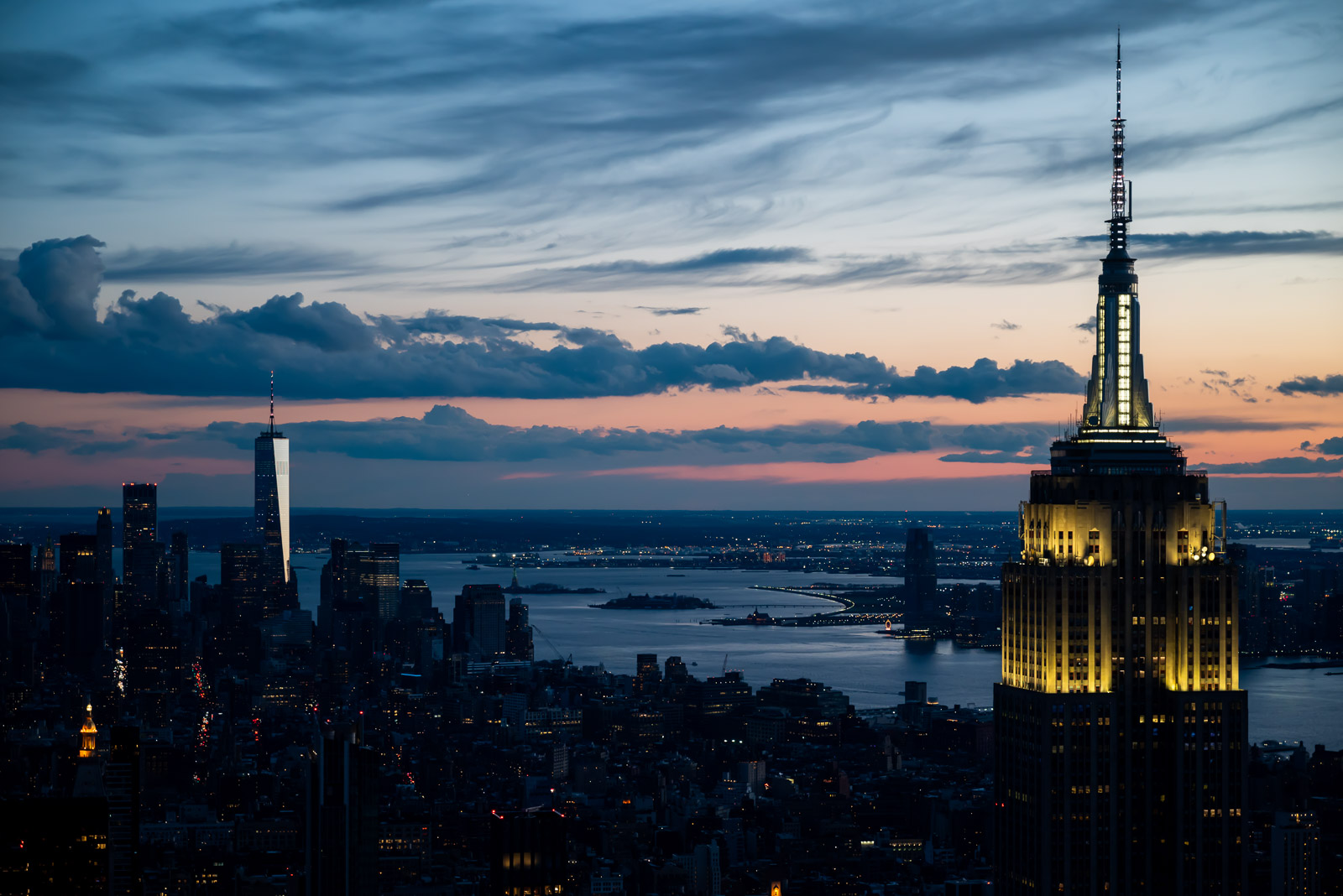 WTC and the Empire State Building stand out together in a Manhattan sunset.