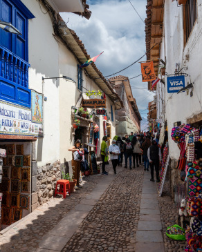 Souvenir shops line a colorful alley in San Blas.
