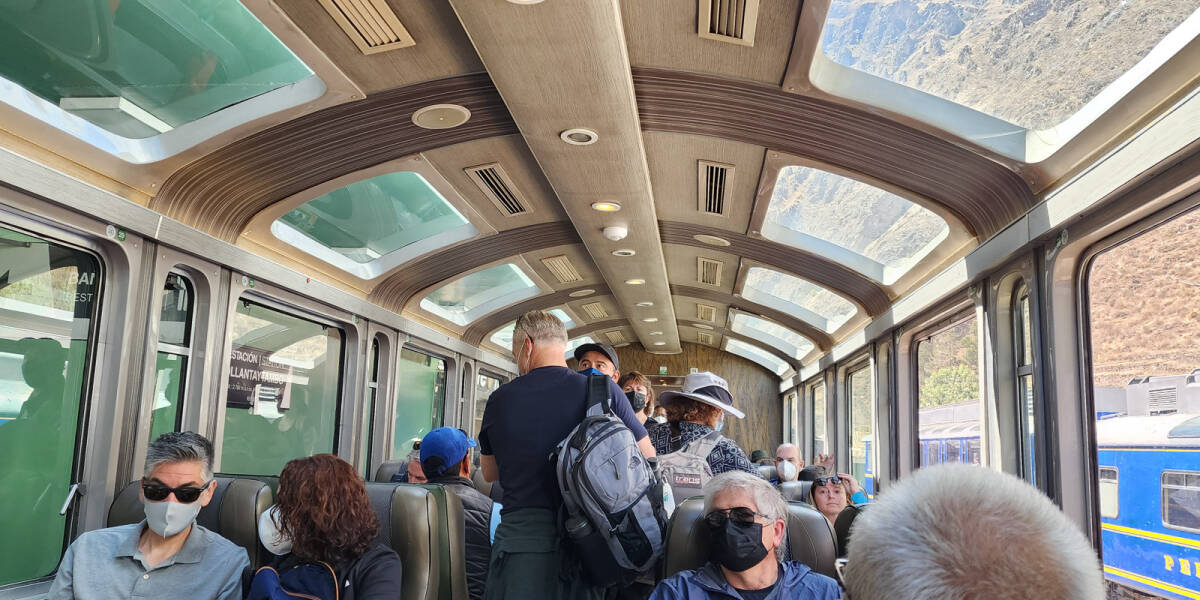 Passengers board the Vistadome train departing from Ollantaytambo station